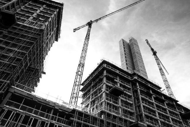 A greyscale image of building under construction