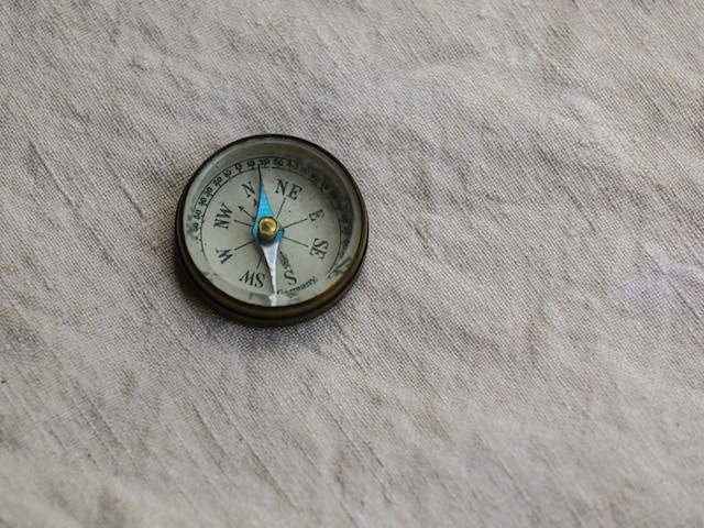 A blue pocket clock in grey background